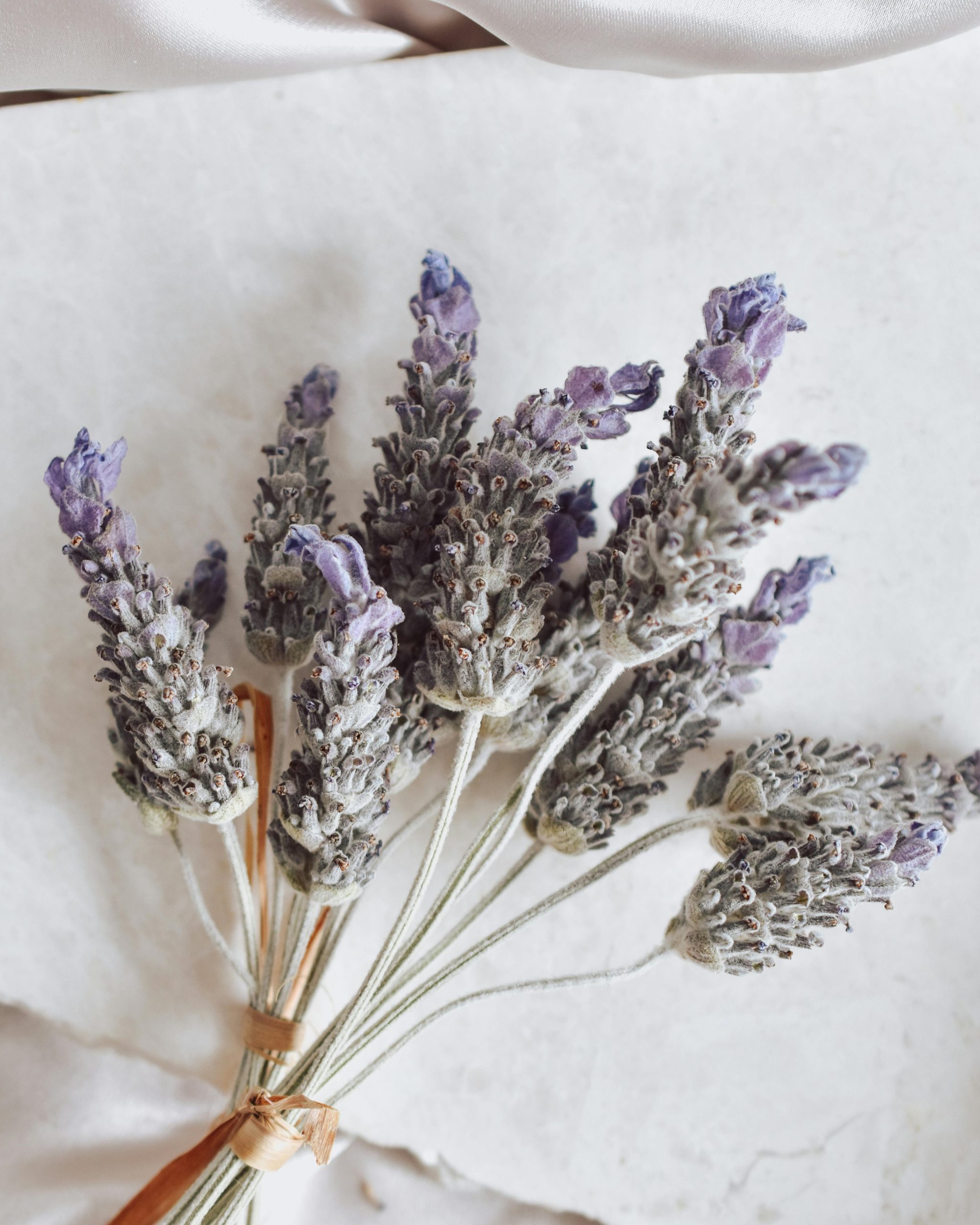 A lavender bouquet arranged beautifully on a marble surface, showcasing natural elegance.